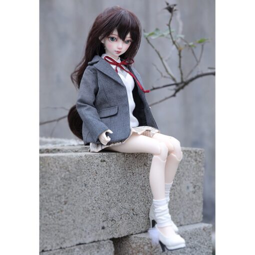 Locha fairy doll sitting outdoors
